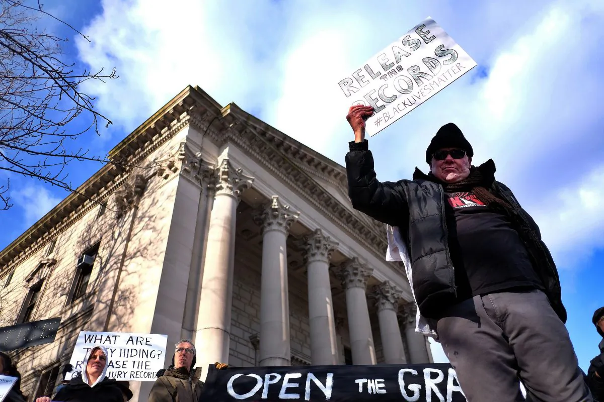 Protesters display a banner and placards during a demonstration outside the courthouse in New York's borough of Staten Island on January 5, 2015. (Jewel Samad/AFP/Getty Images)