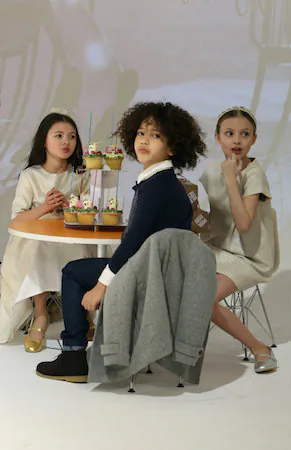 Models play on the runway at the Anais & I show during petitePARADE/Kids Fashion Week at Bathhouse Studios in New York City on Feb. 28, 2015. (Monica Schipper/Getty Images for petitePARADE)