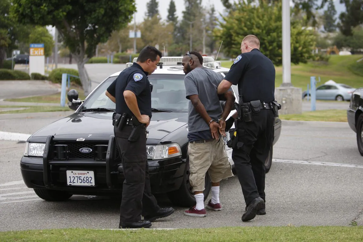 San Bernardino police officers arrest a man on July 12, 2012. 