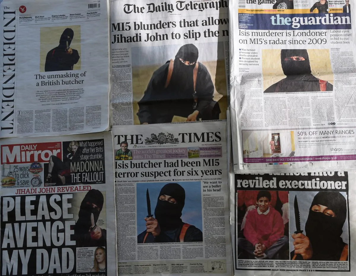 British newspapers shows the front-page headlines and stories regarding the identification of the masked Islamic State group militant dubbed "Jihadi John", Mohammed Emwazi from London. Photographed in London on February 27, 2015. (Daniel SorabjiAFP/Getty Images) 