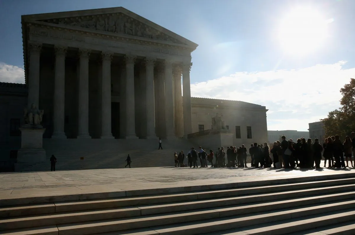 People stand in line to enter the US Supreme Court building, November 12, 2014, in Washington, DC. (Photo by Mark Wilson/Getty Images)