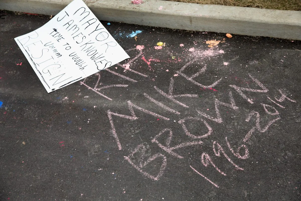 Graffiti chalked onto the police station parking lot remains following last night's protest on March 12, 2015 in Ferguson, Missouri. (Scott Olson/Getty Images)