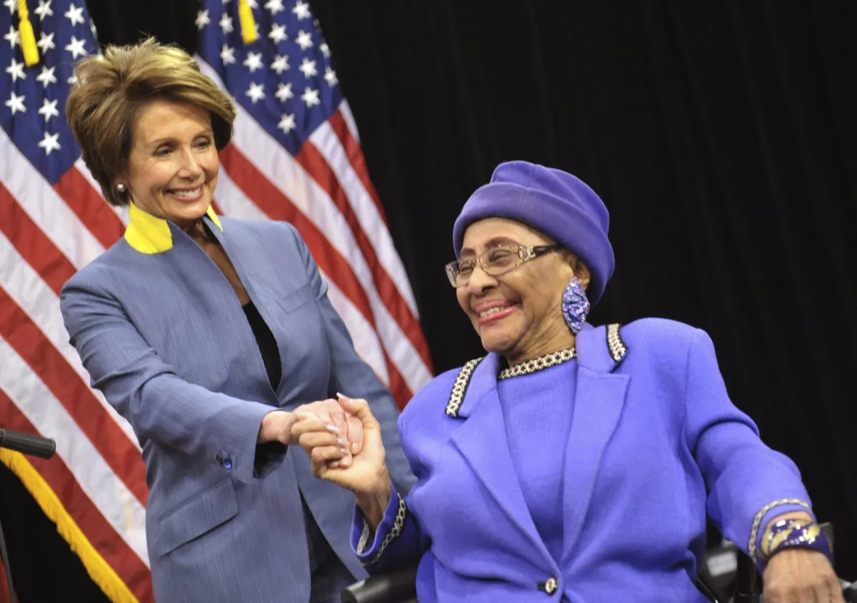 In this March 3, 2012 photo, House Democratic Leader Nancy Pelosi, left, visits with Rev. Willie T. Barrow before a press conference at Operation PUSH headquarters in Chicago. (AP Photo/Sun-Times Media, Al Podgorski)