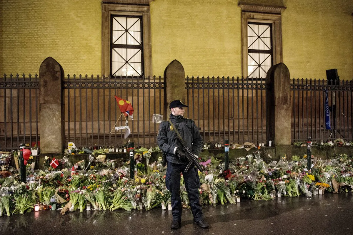 An armed police officer guards outside the Jewish synagogue during a memorial service in Copenhagen on Feb. 24, 2015, for Dan Uzan and Finn Noergaard, who were killed during the twin terrorist attacks the previous week in Copenhagen. (Bax Lindhardt/AFP/Getty Images)