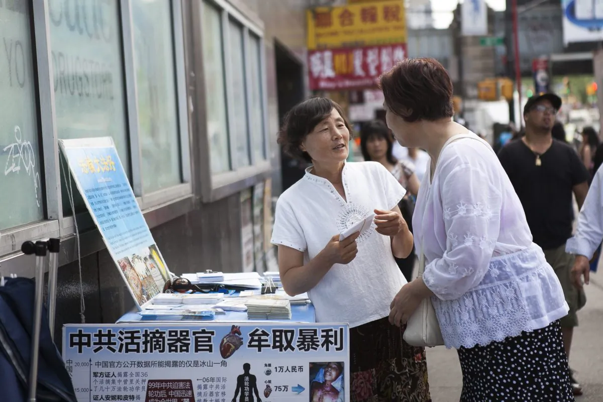 Women at the Global Service Center for Quitting the Chinese Communist Party in Flushing, New York, June 25, 2014. (Samira Bouaou/Epoch Times)