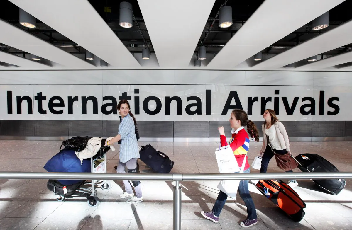 Passengers arrive in Heathrow airport's Terminal 5 on April 21, 2010 in London, England. (Oli Scarff/Getty Images)