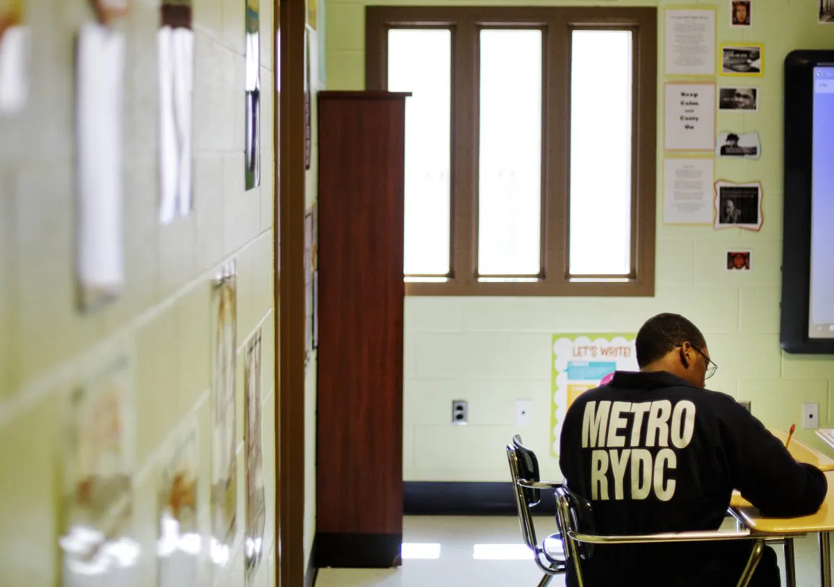 A juvenile resident sits in a classroom at the Georgia Department of Juvenile Justice's Metro Regional Youth Detention Center  in Atlanta, Ga., Aug. 20, 2014. (AP Photo/David Goldman)