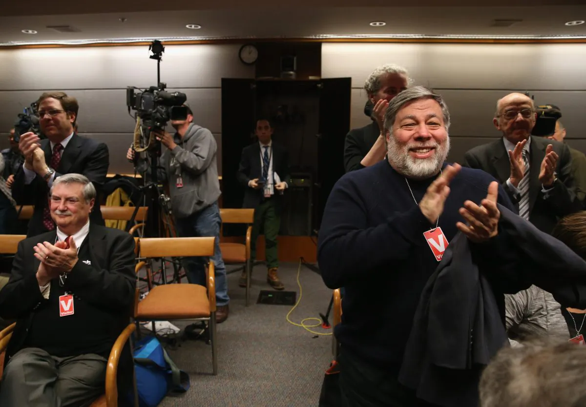 Apple co-founder Steve Wozniak (R) applauds after the Federal Communications Commission (FCC) voted to approve “net neutrality” during a hearing at the FCC headquarters in Washington on Feb. 26, 2015. (Mark Wilson/Getty Images)
