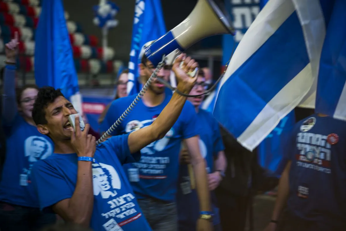 Supporters of the Zionist Union party react to preliminary election results on March 17, 2015 in Tel Aviv, Israel. (Ilia Yefimovich/Getty Images)