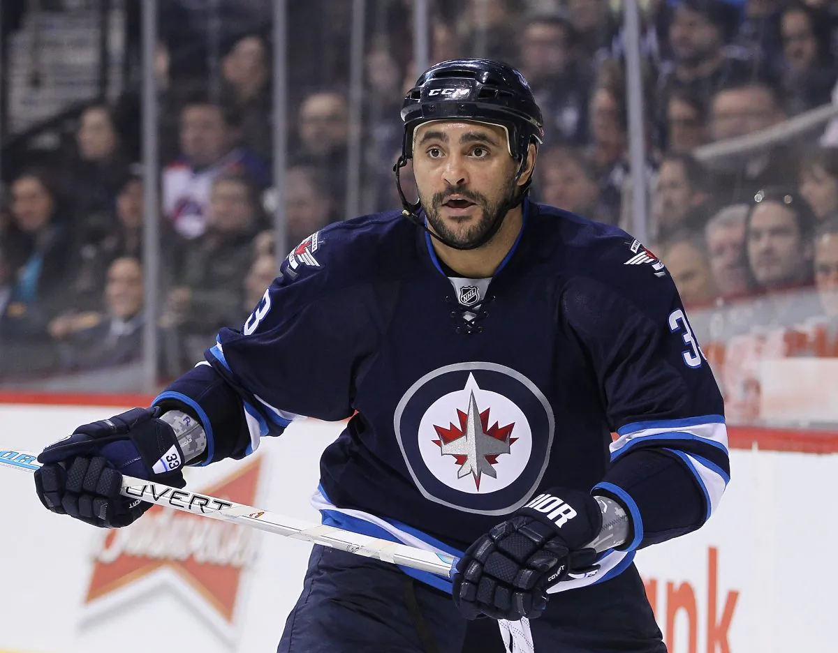 Dustin Byfuglien is seen in action against the Ottawa Senators at the MTS Centre on March 4, 2015 in Winnipeg. The big defenseman suffered an upper-body injury in that game and hasn’t yet returned to action. (Marianne Helm/Getty Images)