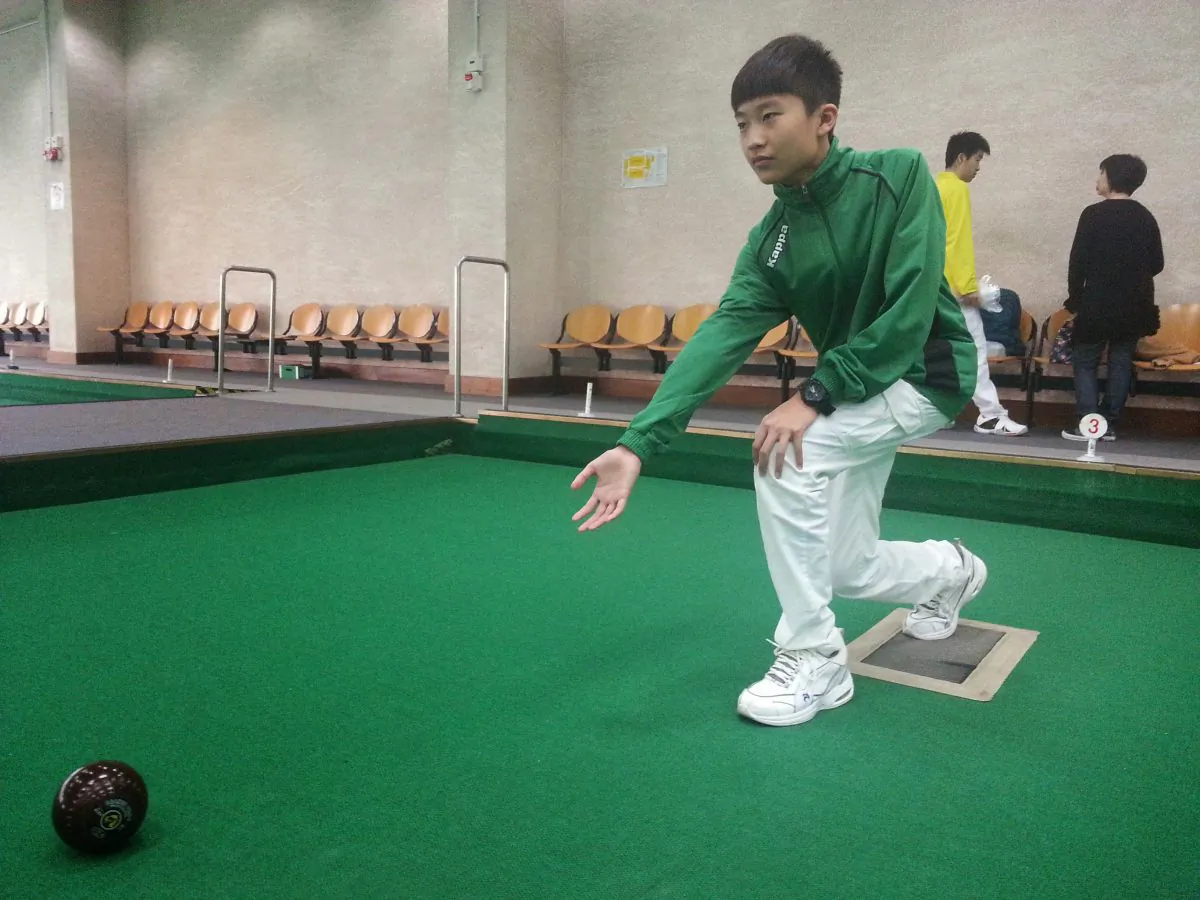 Marcus Tse won his first lawn bowls trophy after prevailing victorious at the final of the Youth Novice competition, at Ap Lei Chau Sports Complex last Sunday, Mar 15, 2015. (Howard Poon)