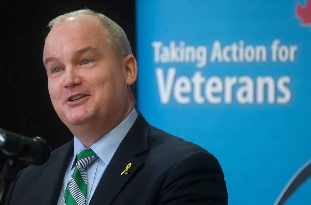 Veterans Affairs Minister Erin O'Toole announces improved benefits for veterans and their families during a news conference in Vancouver on March 17, 2015. A plan to enhance support for seriously injured veterans under the New Veterans Charter and proposed new support for informal caregivers such as family members was announced. (The Canadian Press/Darryl Dyck)