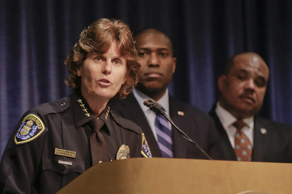 Current San Diego Police Chief Shelley Zimmerman, flanked by Associated United States Attorney General Tony West and Community Oriented Policing Services office Director Ron Davis, right, talks about the federal investigation of the San Diego Police Department at a news conference, Monday, March 24, 2014, in San Diego, Calif. (AP Photo/Lenny Ignelzi)