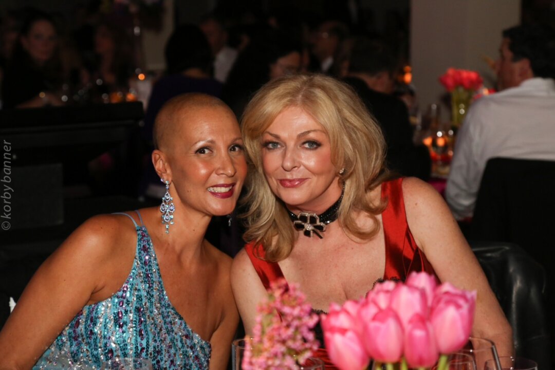 Eight-time cancer survivor Dionne Warner (L) poses with women’s cancer care advocate Sherry Abbott on Nov. 22, 2014, at Mirror Ball, an annual fundraising gala in support of people affected by cancer. Warner is a participant in the Look Good Feel Good program, which is dedicated to improving the self-esteem of patients undergoing cancer treatment. (Courtesy Sherry Abbott)