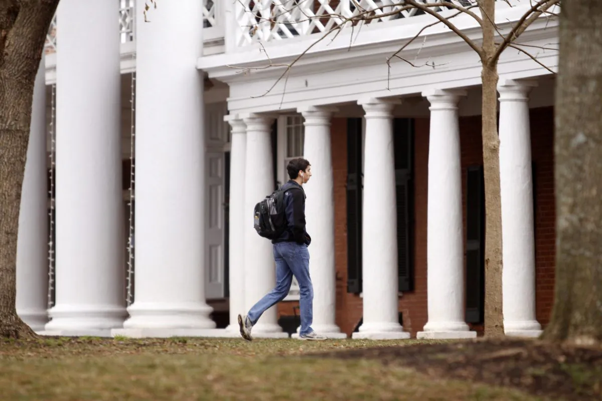 A fourth year student at the University of Virginia, walks across campus on December 6, 2014 in Charlottesville, Virginia. (Jay Paul/Getty Images)