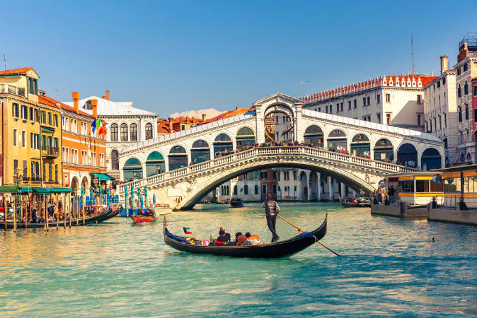 Gondola near Rialto Bridge in Venice, Italy via Shutterstock*