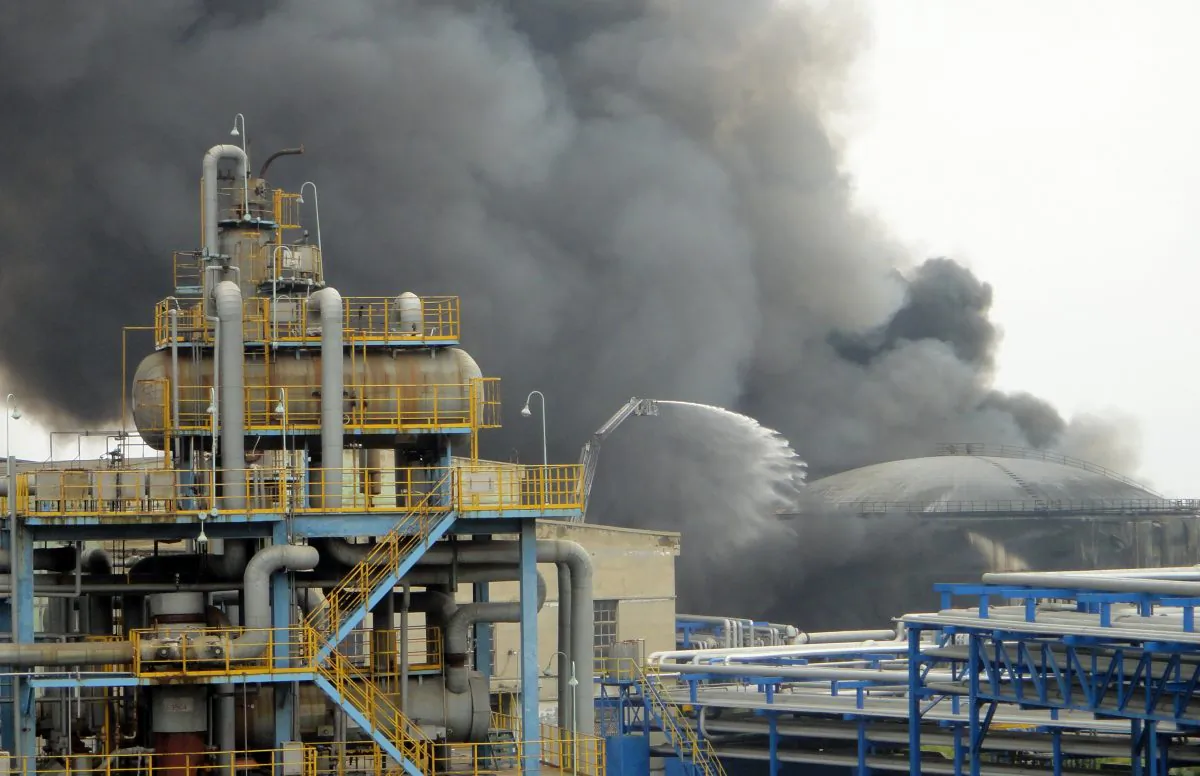Firefighters attempt to extinguish a fire at PetroChina’s oil refinery in Dalian on August 29, 2011. Liao Yongyuan, General Manager of PetroChina, has been taken away for an investigation. (STR/AFP/Getty Images)