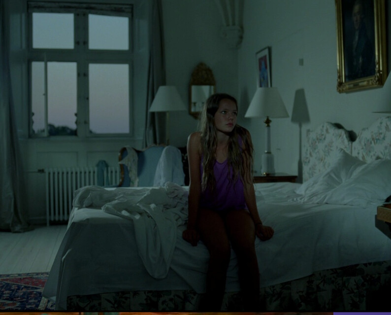 girl sits on bed in "Jauja"