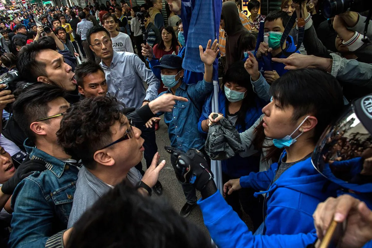 Protestors clash with pro-government supporters in Yuen Long during a rally against parallel-goods trading on Mar. 1, 2015 in Hong Kong. (Lam Yik Fei/Getty Images)