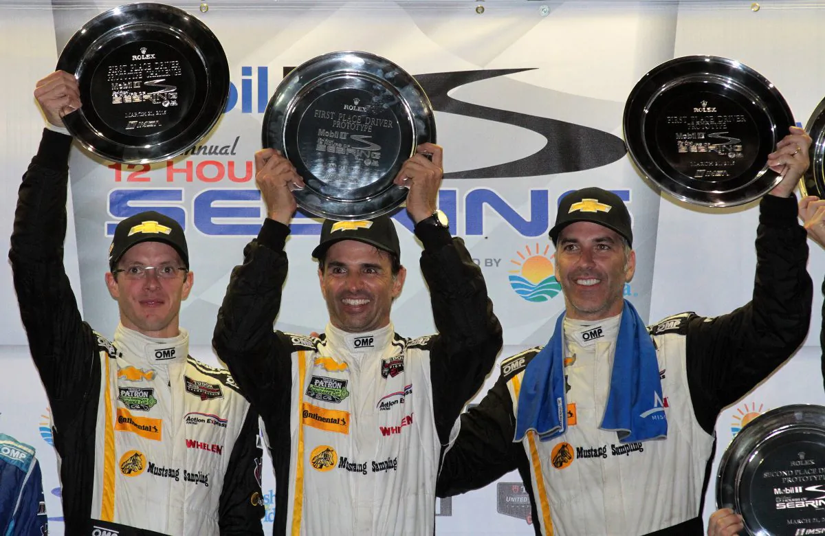 Sebastien Bourdais, Christian Fittipaldi, and Joao Barbosa celebrate winning the Tudor United SportsCar Championship 63rd Twelve Hours of Sebring. (Chris Jasurek/Epoch Times)
