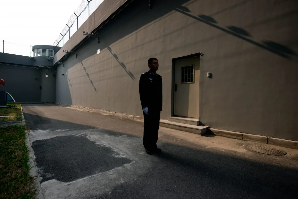 A guard in a courtyard inside the No.1 Detention Center in Beijing on Oct. 25, 2012. (Ed Jones/AFP/Getty Images)