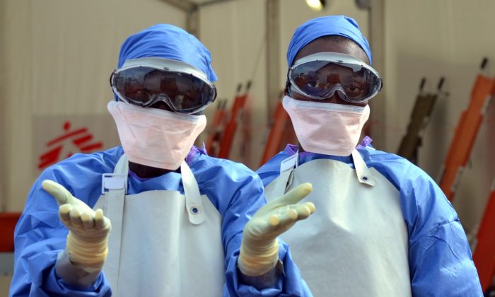 Liberian health workers at an Ebola treatment center in Monrovia, on October 18, 2014. (Zoom Dosso/AFP/Getty Images)