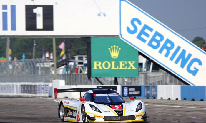 The eventual race winner, the #5 Action express racing Coyote-Corvette, streaks down the front straight early in the Tudor United SportsCar Championship 63rd 12 Hours of Sebring, March 21, 2015. (Chris Jasurek/Epoch Times)