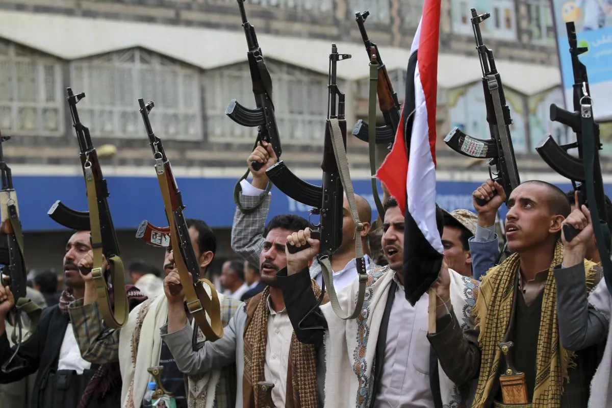 Shiite rebels, known as Houthis, hold up their weapons to protest against Saudi-led airstrikes, during a rally in Sanaa, Yemen, Thursday, March 26, 2015. (AP Photo/Hani Mohammed)