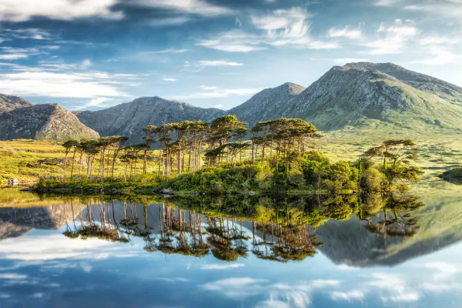 Derryclare Lough, Connemara mountains in the background in Ireland via Shutterstock*