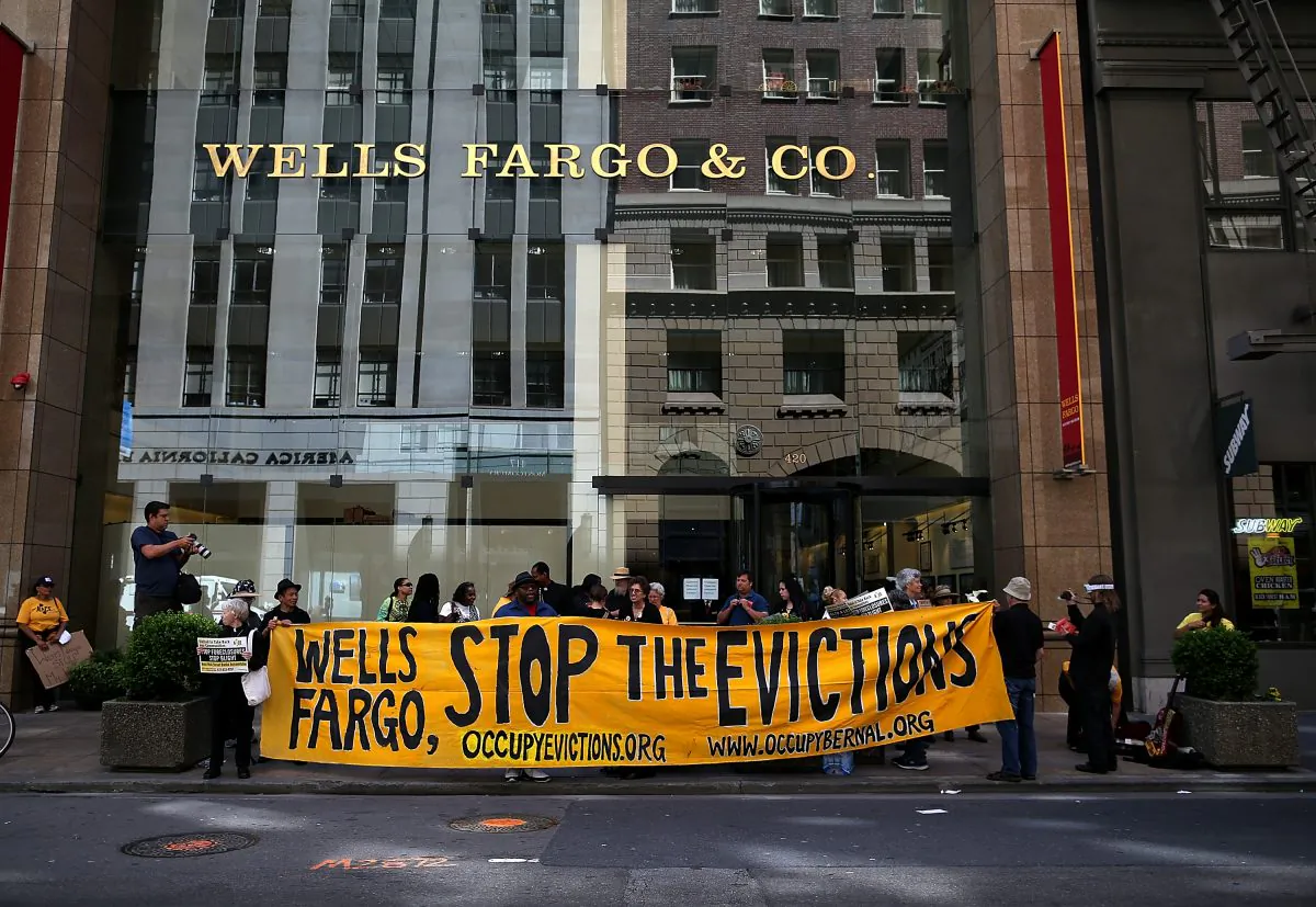 Protesters outside of the Wells Fargo headquarters in San Francisco on April 23, 2013. A few dozen protested to support those who have lost their homes to foreclosure because of Wells Fargo’s lending practices. (Photo by Justin Sullivan/Getty Images)