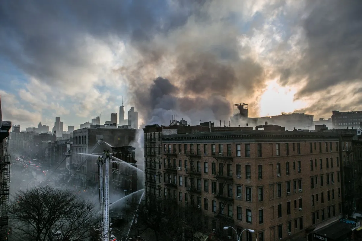 Firefighters on scene in the East Village on March 26, 2015, after a fiery building collapse. About 250 firefighter dealt with the explosion that caused a dozen injuries and the adjacent building to collapse. (Samira Bouaou/Epoch Times)