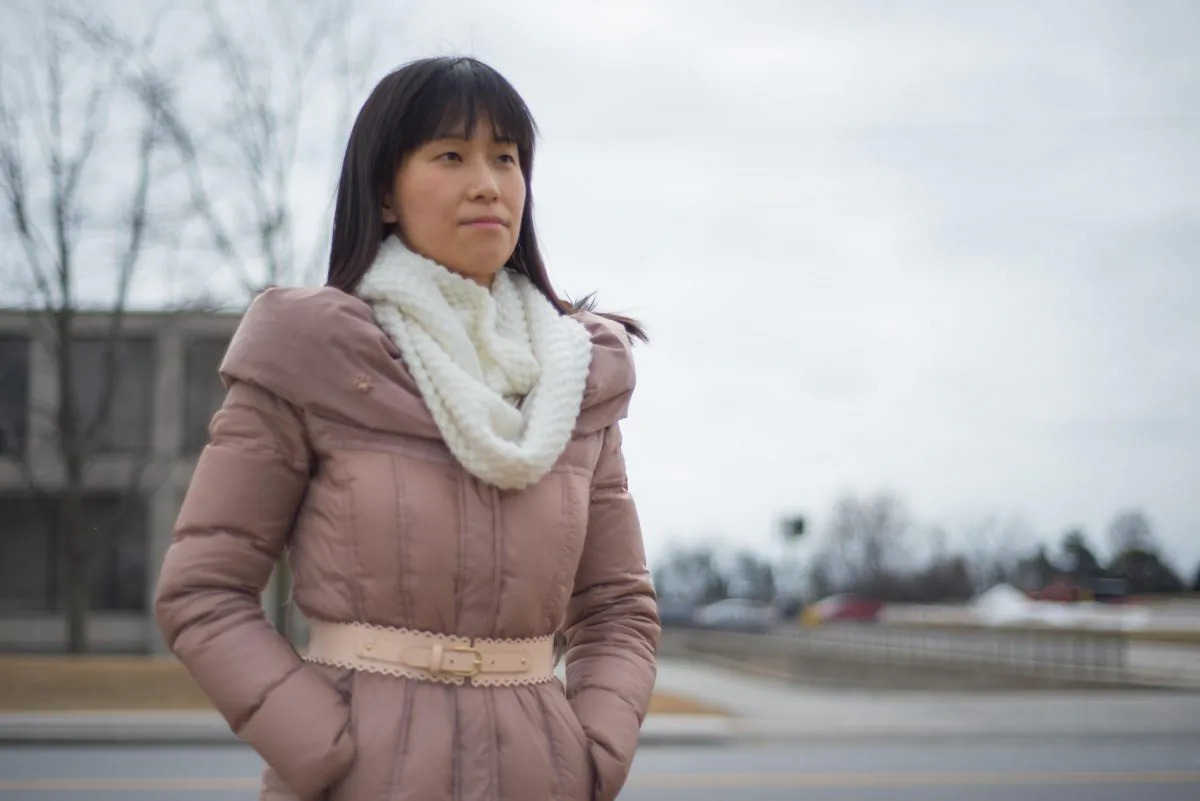 Epoch Times reporter Beck Zhou was corralled into a corner by six men working under the direction of Industrial and Commercial Bank of China (Canada) at an event attended by Finance Minister Joe Oliver on March 23, 2015. (Matthew Little/Epoch Times)