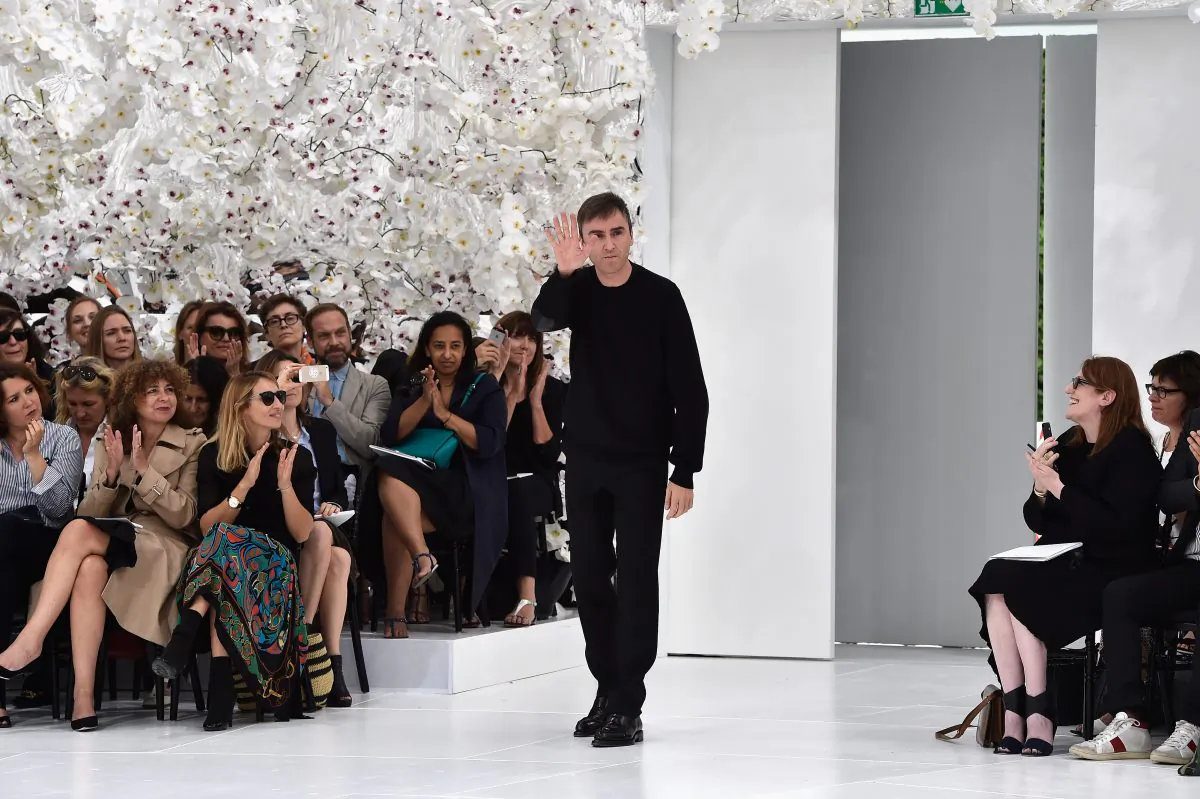Designer Raf Simons acknowledges the applause of the audience after the Christian Dior show as part of Paris Fashion Week - Haute Couture Fall/Winter 2014-2015 on July 7, 2014 in Paris, France.  (Pascal Le Segretain/Getty Images)