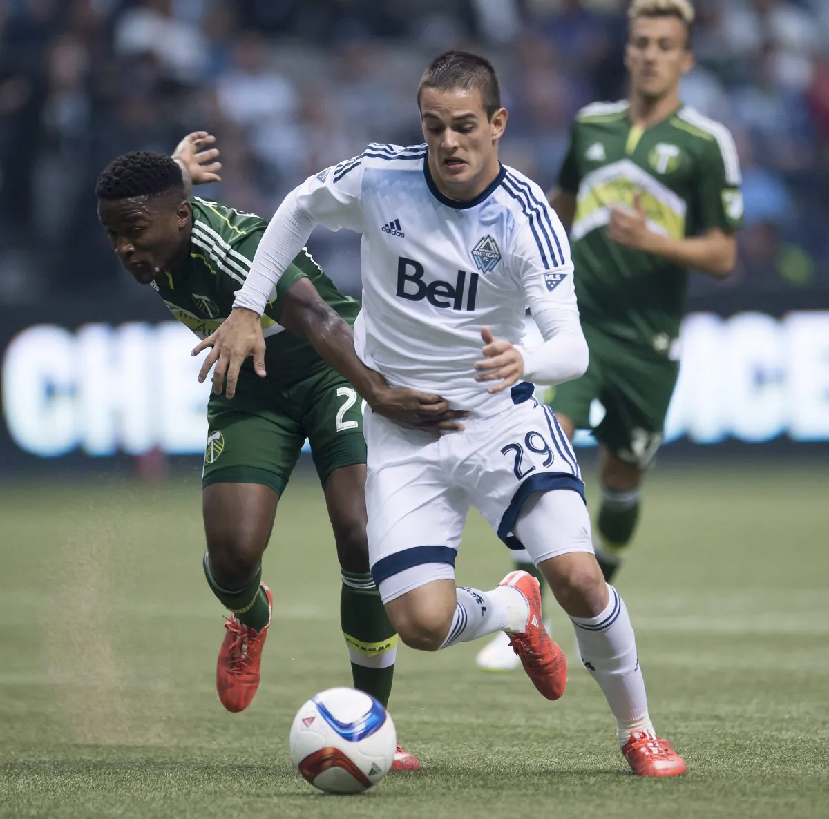 Vancouver's Octavio Rivero fights for control of the ball with Portland’s George Fochive in Vancouver on March 28, 2015. Rivero was held off the scoresheet for the first time in four games against Portland. (The Canadian Press/Jonathan Hayward)