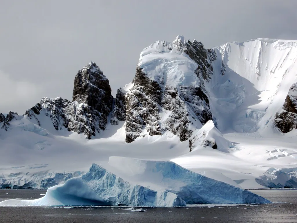 Spigot Peak on the Antarctic Peninsula facing Cuverville Island was named for its resemblance to a wooden peg. (David Stanley, CC BY)