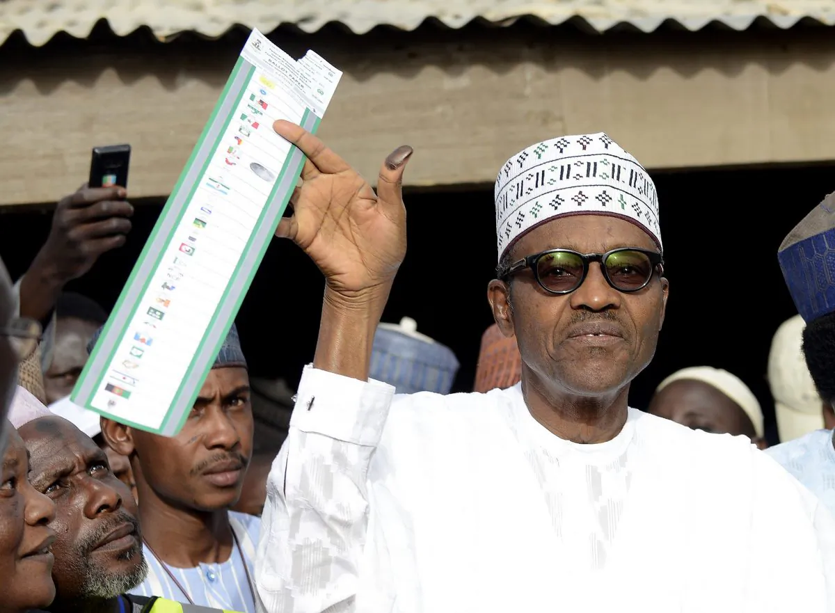 Main opposition All Progressives Congress (APC) presidential candidate Mohammadu Buhari holds his ballot paper prior to casting his vote at a polling station in the "Gidan Niyam Sakin Yara A ward" at Daura in Katsina State on March 28, 2015.  (Pius Utomi Ekpei/AFP/Getty Images)