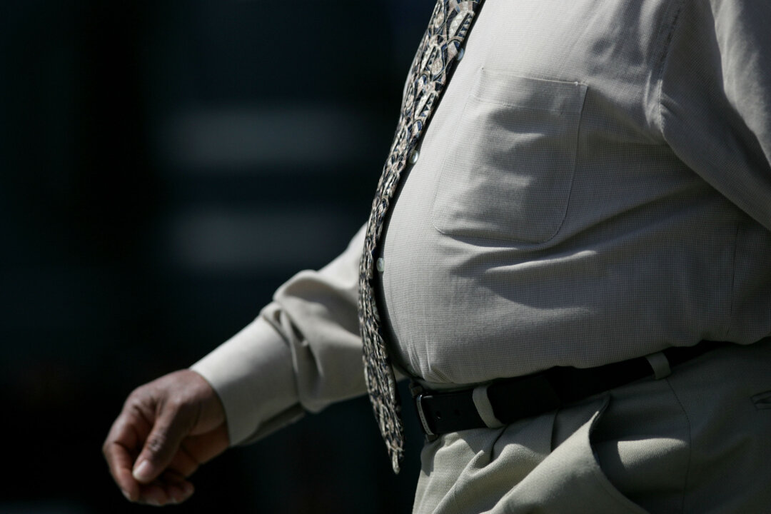 A man walks along the Embarcadero in San Francisco on April 6, 2005. (Justin Sullivan/Getty Images)