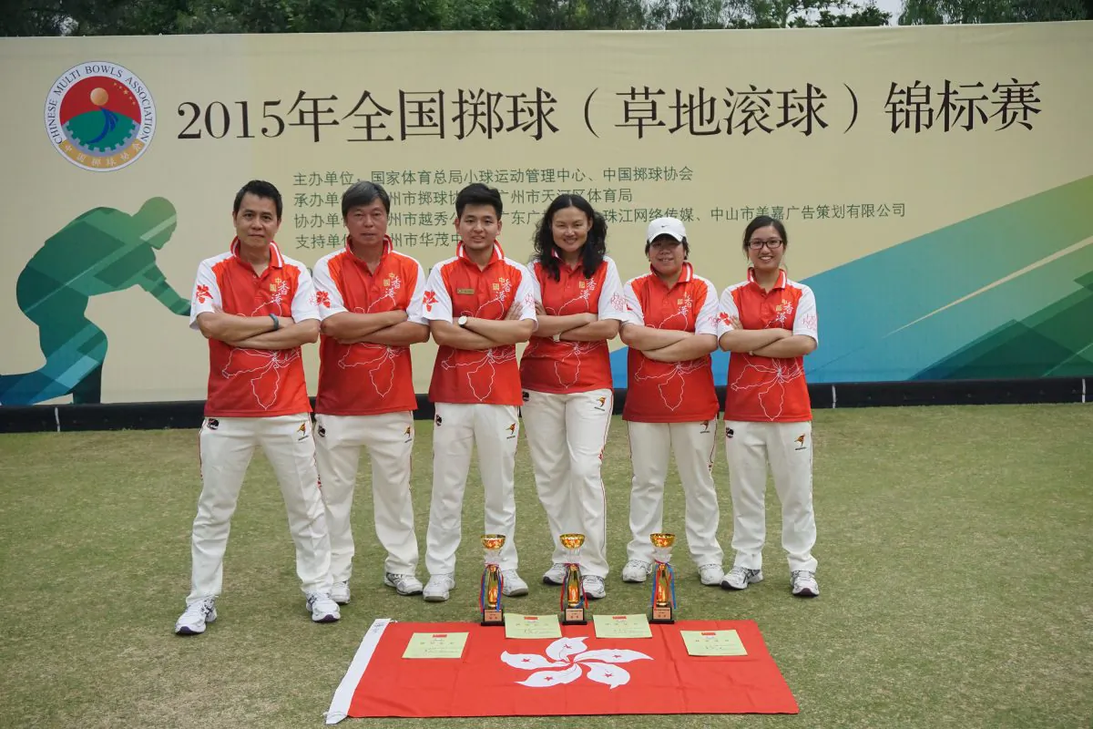 PRIDE OF HONG KONG – The Hong Kong lawn bowls team proudly displays the three trophies they won at the 3rd Chinese National Lawn Bowls Championship in Guangzhou on March 28, 2015. Team members include (from L): Claudius Lam (manager), Timmy Kwong, Ken KK Chan, Helen Cheung, Vivian Yip, and Amy Choi (manageress).  (Cyril Leung)