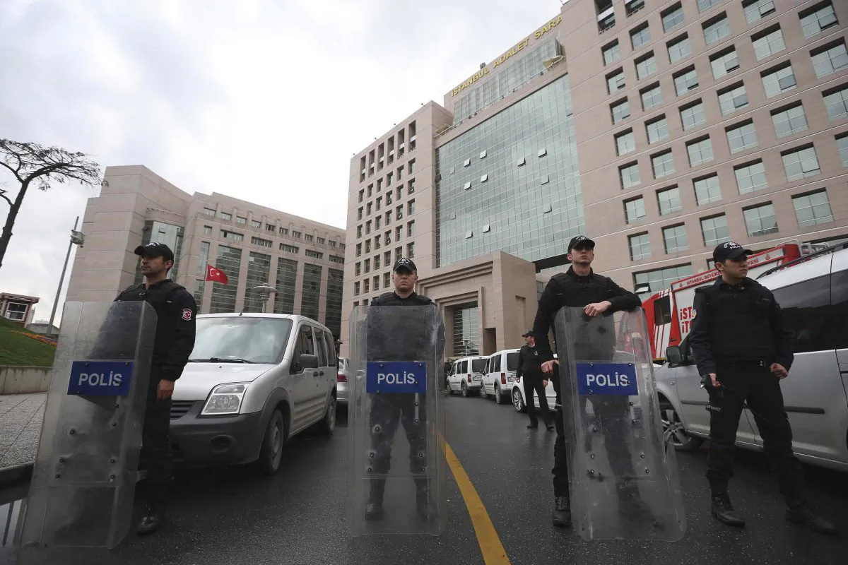 Members of security forces stand outside the main courthouse in Istanbul, Turkey, Tuesday, March 31, 2015. (AP Photo/Emrah Gurel)