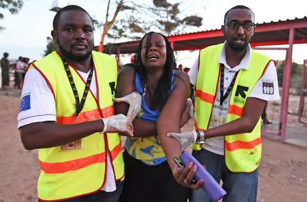 Paramedics help a student who was injured during an attack by Somalia's Al-Qaeda-linked Shebab gunmen on the Moi University campus in Garissa on April 2, 2015. At least 70 students were massacred when Somalia's Shebab Islamist group attacked a Kenyan university today, the interior minister said, the deadliest attack in the country since US embassy bombings in 1998. AFP PHOTO / CARL DE SOUZA (Photo credit should read CARL DE SOUZA/AFP/Getty Images)