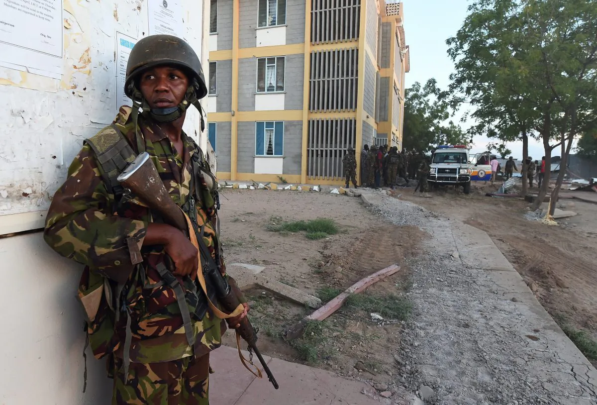 A member of the Kenyan Defence Forces stands guard at the Garissa University campus after an attack by Somalia's Al-Qaeda-linked Shebab gunmen in Garissa on April 2, 2015. At least 70 students were massacred when Somalia's Shebab Islamist group attacked a Kenyan university today, the interior minister said, the deadliest attack in the country since US embassy bombings in 1998. AFP PHOTO / CARL DE SOUZA (Photo credit should read CARL DE SOUZA/AFP/Getty Images)
