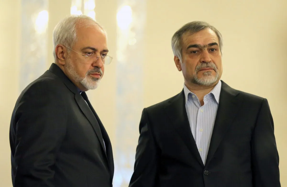 Iranian Foreign Minister Javad Zarif (L) and Hossein Fereydoun, President Rouhani's younger brother and adviser, look on during a press conference of President Hassan Rouhani (unseen) in Tehran on April 3, 2015. (Atta Kenare/AFP/Getty Images)