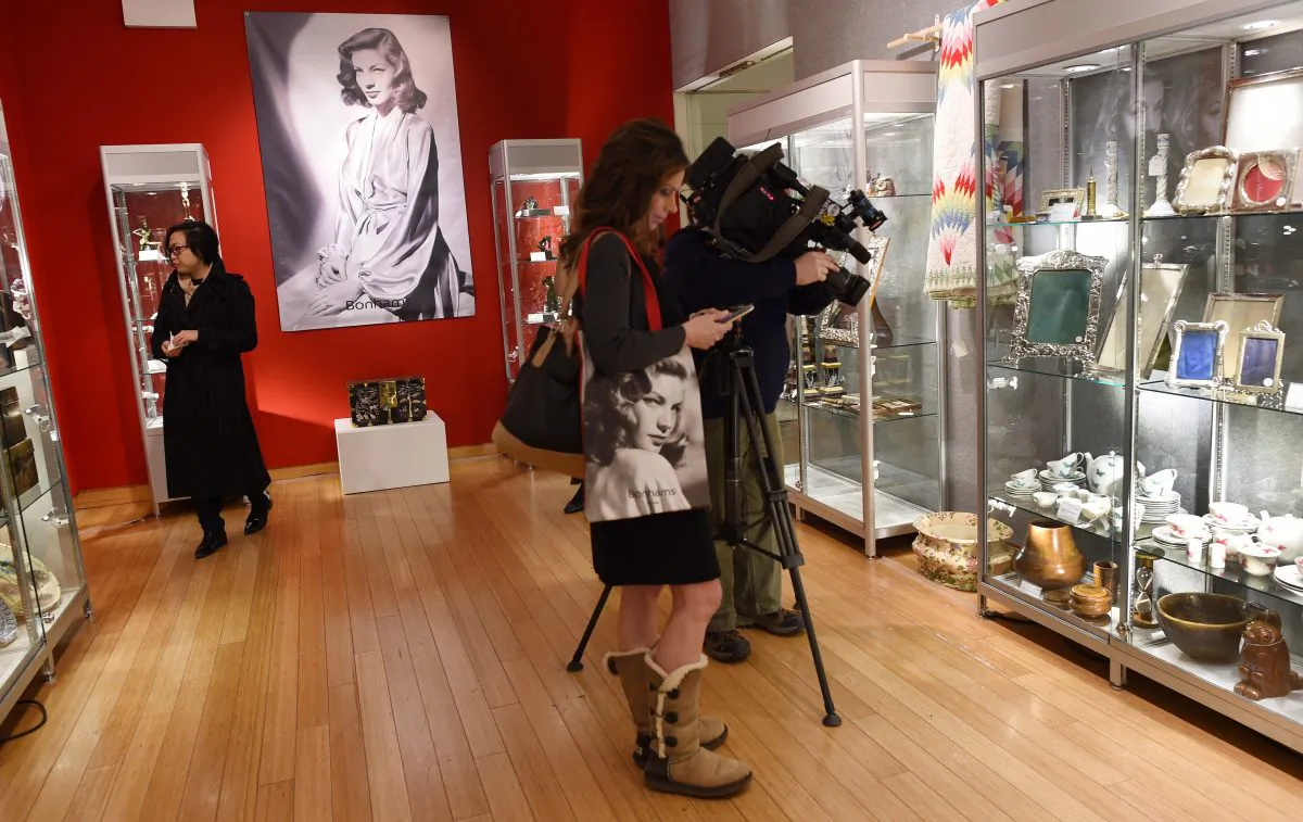 Reporters and camera crews get a preview of items from the Lauren Bacall Collection at Bonham's in New York on March 24, 2015. (DON EMMERT/AFP/Getty Images)