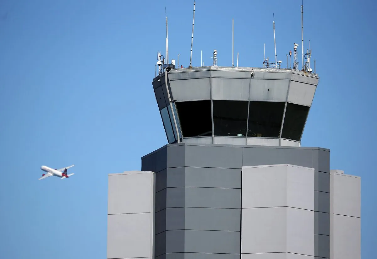 A plane takes off past the control tower at San Francisco International Airport on February 25, 2013 in San Francisco, California. Computers of the Federal Aviation Administration were recently attacked by hackers. (Justin Sullivan/Getty Images)