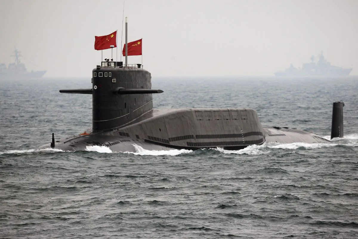 A Chinese Navy nuclear-powered submarine sails during an international fleet review to celebrate the 60th anniversary of the founding of China's navy, on April 23, 2009. (Guang Niu/AP Photo)