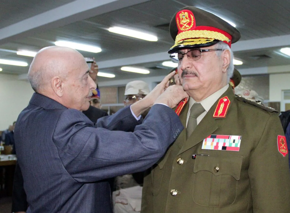 Anti-Islamist Gen. Khalifa Haftar (R) during his swearing-in ceremony as the new army chief in Libya, in the eastern city of Tobruk, on March 9, 2015. (STR/AFP/Getty Images)