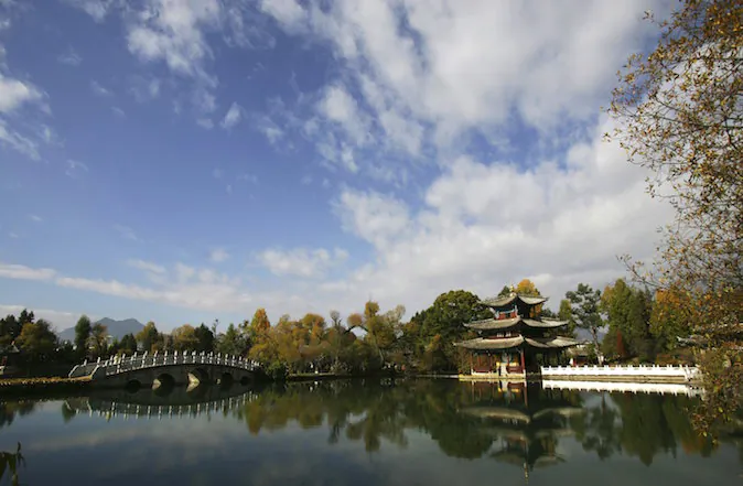 Heilongtan Park in the Lijiang ancient township of Yunnan Province, China, on Nov. 24, 2006. (China Photos/Getty Images)