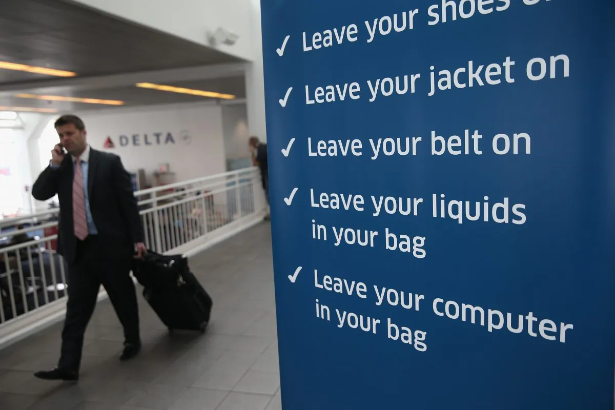 A traveler walks past a newly-opened TSA Pre-check application center at LaGuardia Airport on January 27, 2014 in New York City. (John Moore/Getty Images)