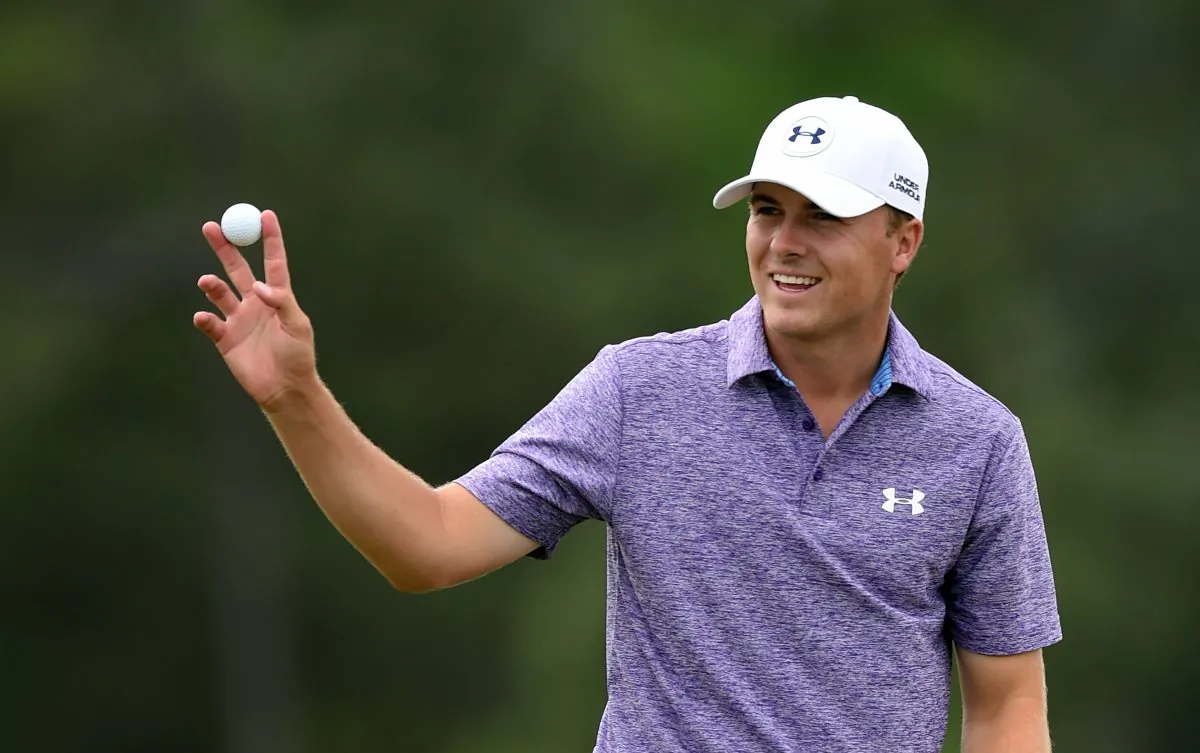 Jordan Spieth of the US waves to patrons at the 18th hole during Round 2 of the 79th Masters Golf Tournament at Augusta National Golf Club on April 10, 2015, in Augusta, Georgia. (Jim Watson/AFP/Getty Images)