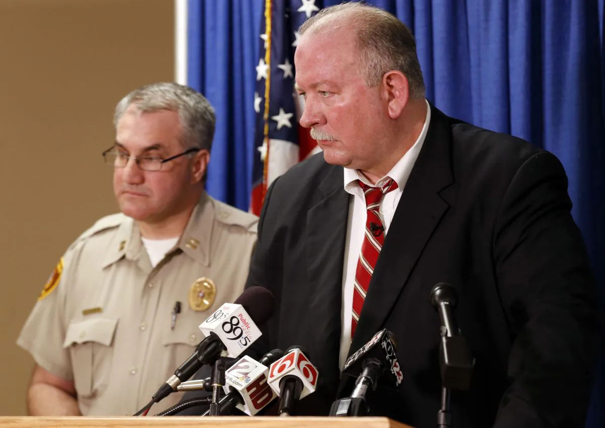 In this Friday, April 10, 2015, photo, Jim Clark, right, an independent consultant, speaks next to Tulsa County Sheriff's Office Capt. Billy McKelvey during a press conference about the investigation of the death of Eric Harris in Tulsa, Okla. Police say a reserve sheriff's deputy thought he was holding a stun gun, not his handgun, when he fatally shot Harris during an arrest that was caught on video in Tulsa. (Cory Young/Tulsa World via AP)